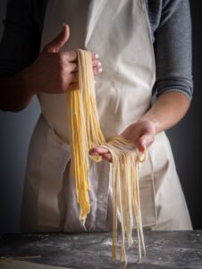 pasta-chef-holding-pasta-fasta-la-pasta-1